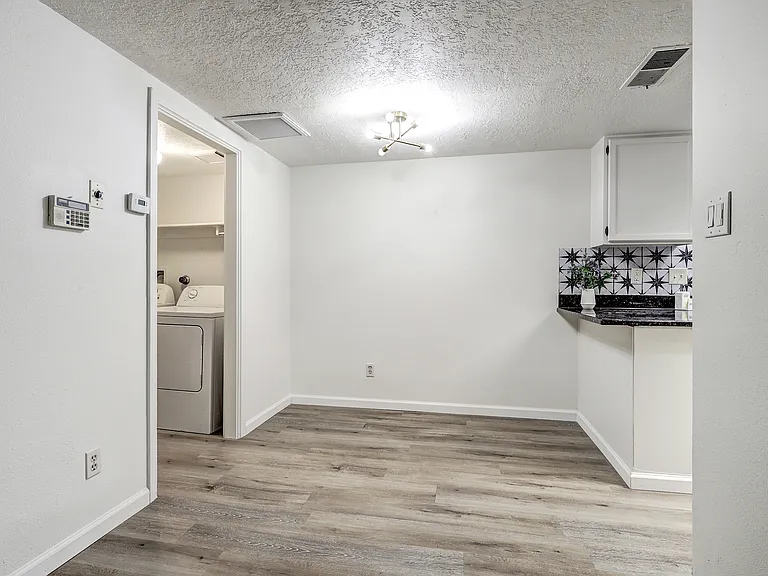Dining Area - Powder Room and Washer / Dry to left, Kitchen to right