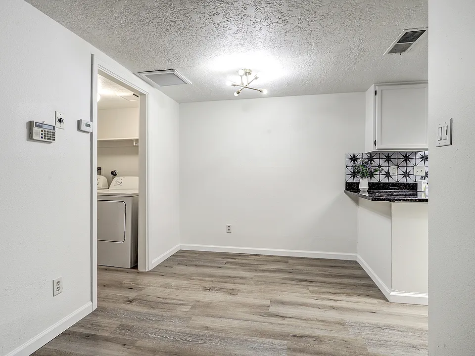 Dining Area - Powder Room and Washer / Dry to left, Kitchen to right