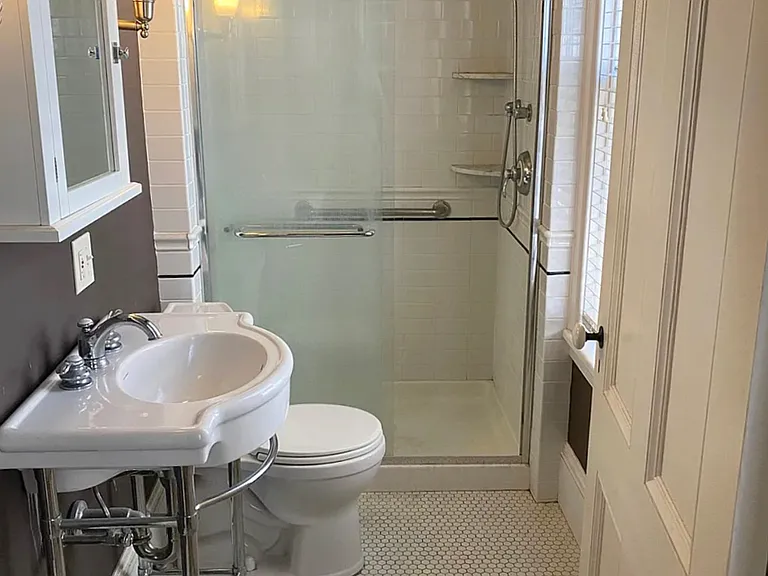 Sunny bathroom with walk-in shower