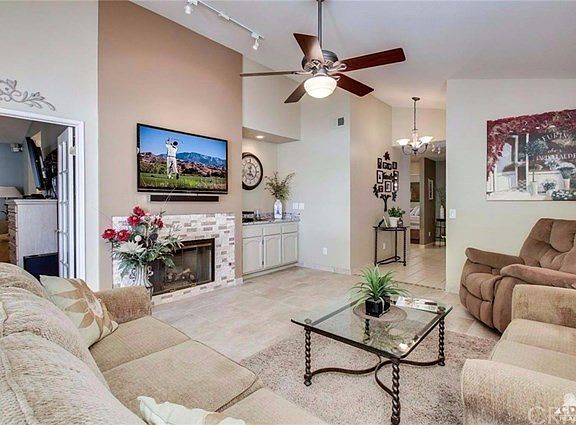 The spacious living area is a highlight of this beautiful home. The unique tile treatment around the