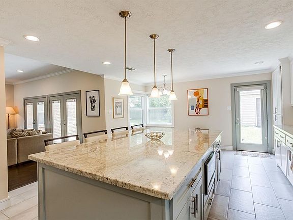 Double ovens, gas range and built in microwave are just a few of the extra special bonuses in this open concept kitchen!