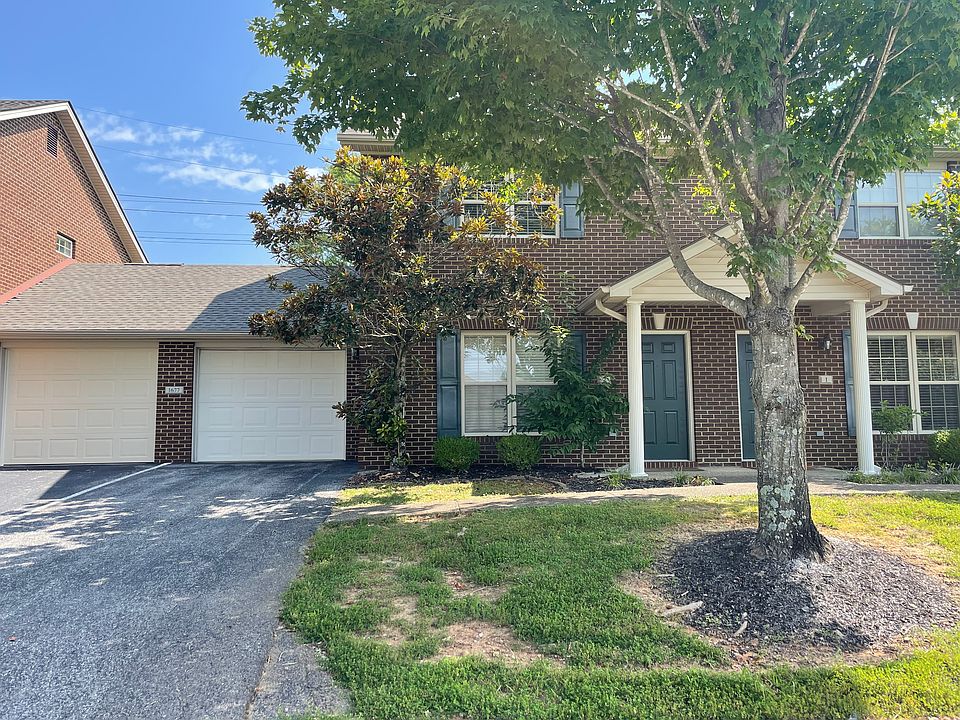 front unit picture door to the left and single car garage