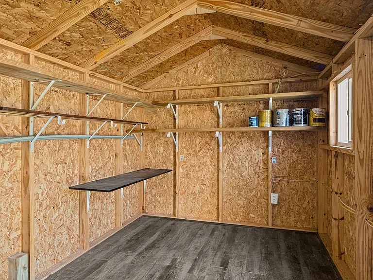 SHED IS SET UP WITH ELECTRICAL, SHELVES, AND WORKBENCH AREA (not in picture)!