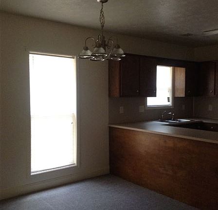 Can place table under light in front of counter in Kitchen