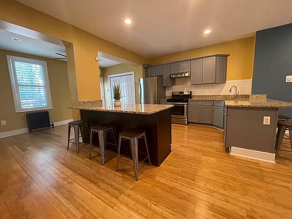 Open and spacious kitchen that can seat 6-8! Bar stools for 6 included for use.
