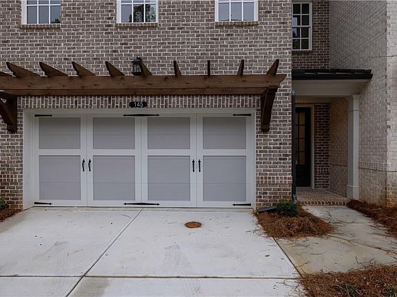 Garage with concrete driveway