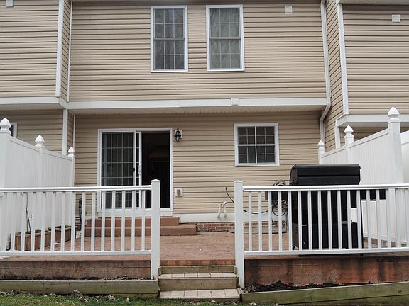 Large enclosed patio with planting boxes