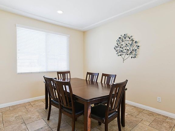 The dining room with recessed ceiling lights.