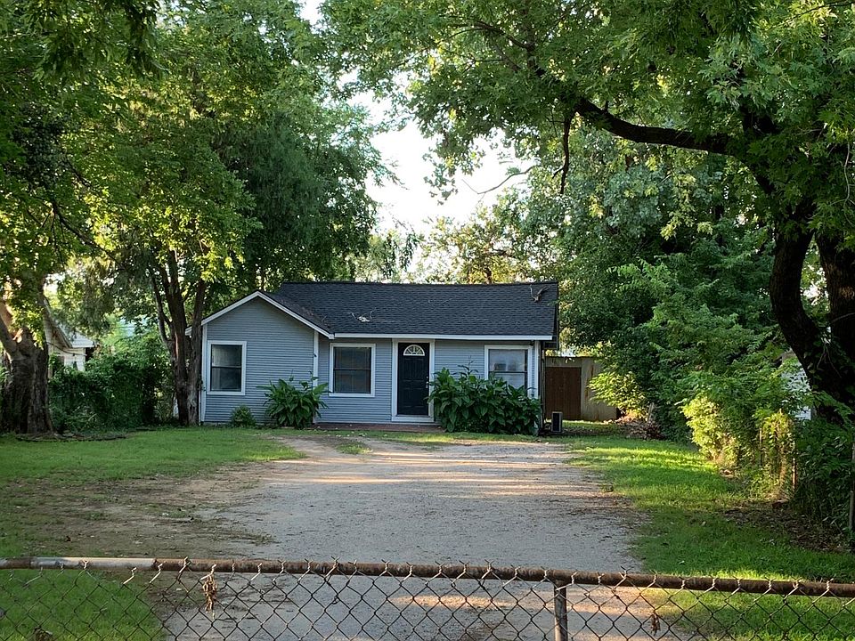 Front view of large shaded welcoming home