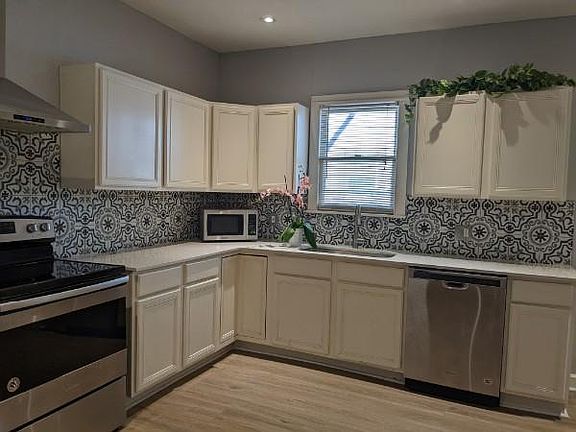 Kitchen with new floors and backsplash