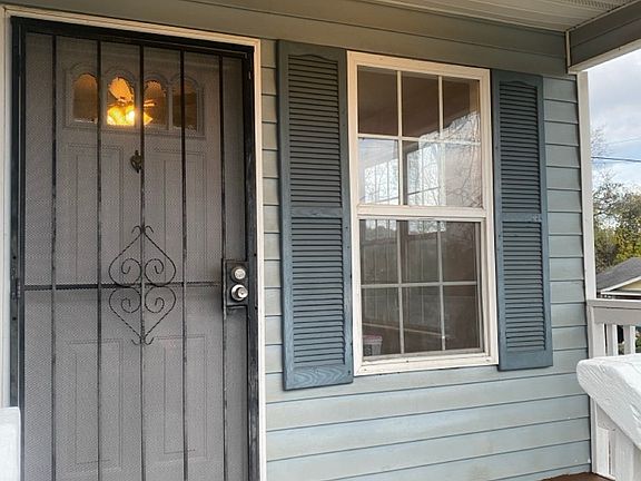 Front porch area. Fits two chairs and table.