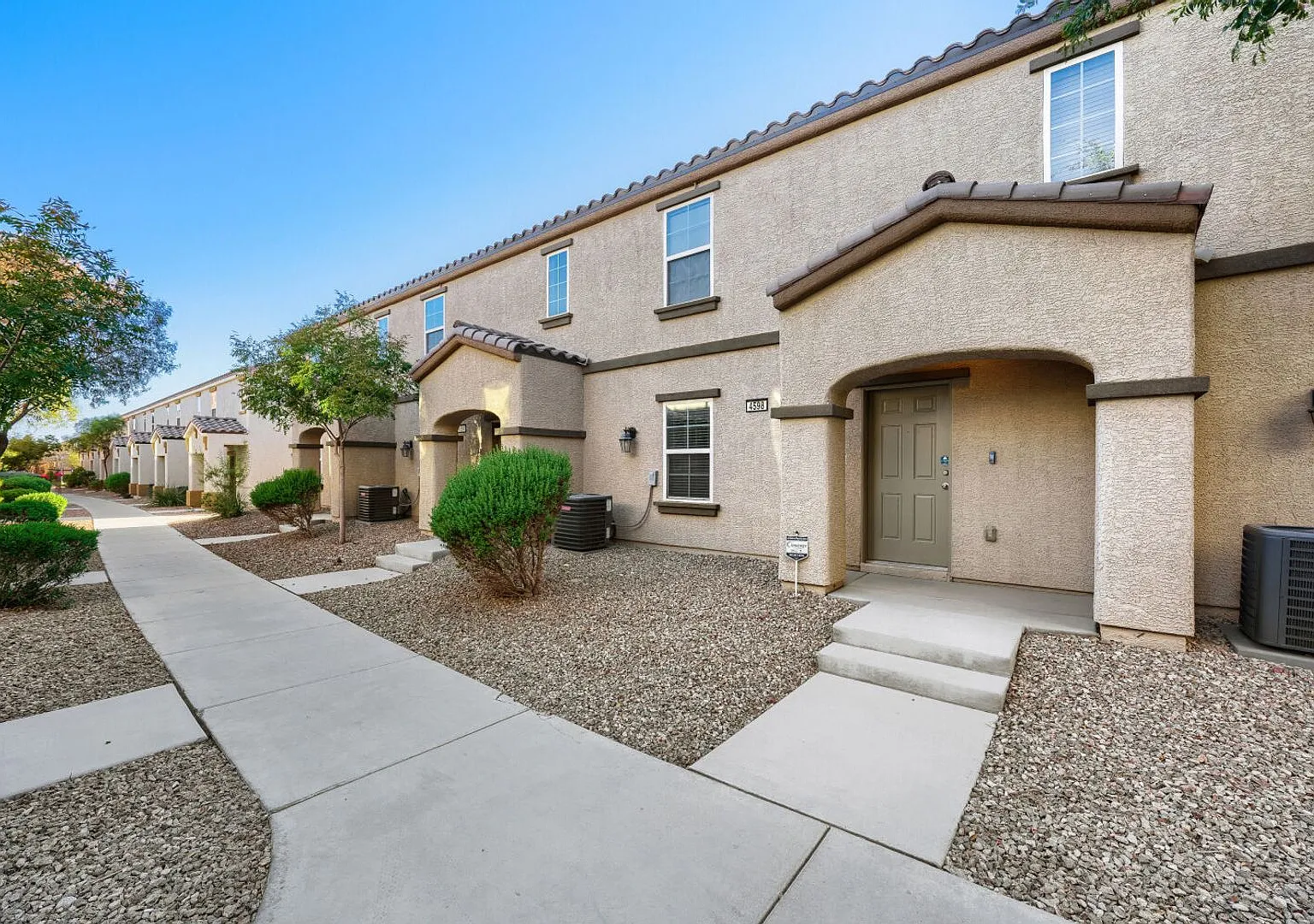 Gated Sunrise Manor Townhome with Pool & Gym — Photo 1