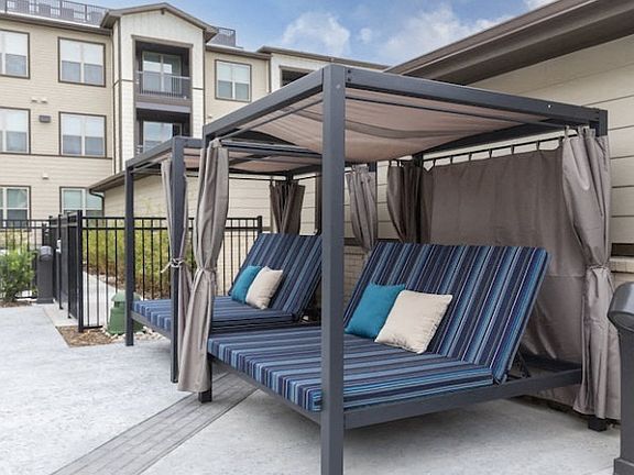 Resort-Style Pool with Tanning Ledges, Cabanas & Hot Tub at The Bridge at McKinney