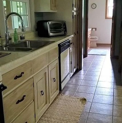 Kitchen looking into hall where 2nd bath is located
