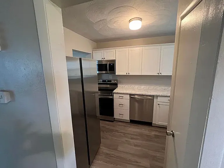 Enjoy a bright, inviting kitchen featuring new stainless-steel appliances and a clean, updated look. The modern appliances add both style and convenience, creating a comfortable space for cooking, dining, and everyday living.