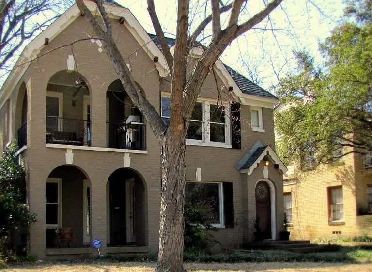 Front of Duplex. Entry on the Right with the stained glass window in the door.