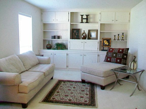 FORMAL LIVING WITH BUILT IN BOOK SHELVES & DISPLAYS