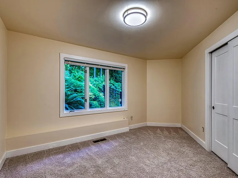 1 of 5 bedrooms in the home. This bedroom is the only one downstairs
