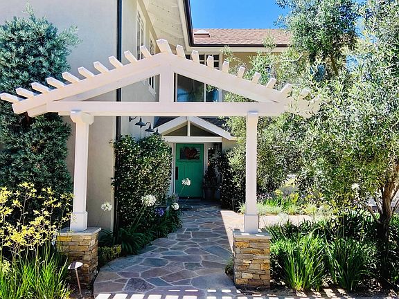 charming entry with mature landscape