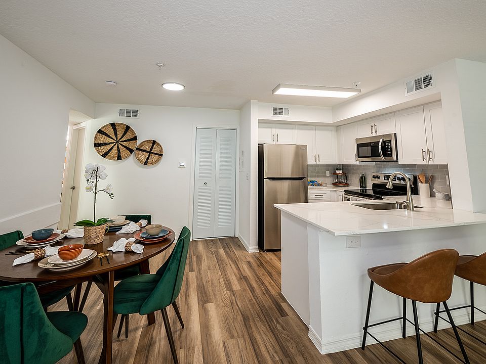 Open-concept living with breakfast bar kitchen
