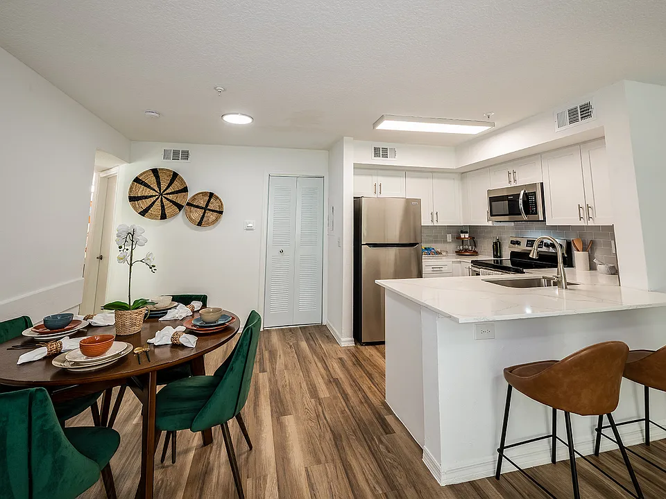 Open-concept living with breakfast bar kitchen