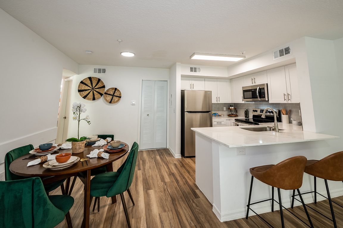 Open-concept living with breakfast bar kitchen
