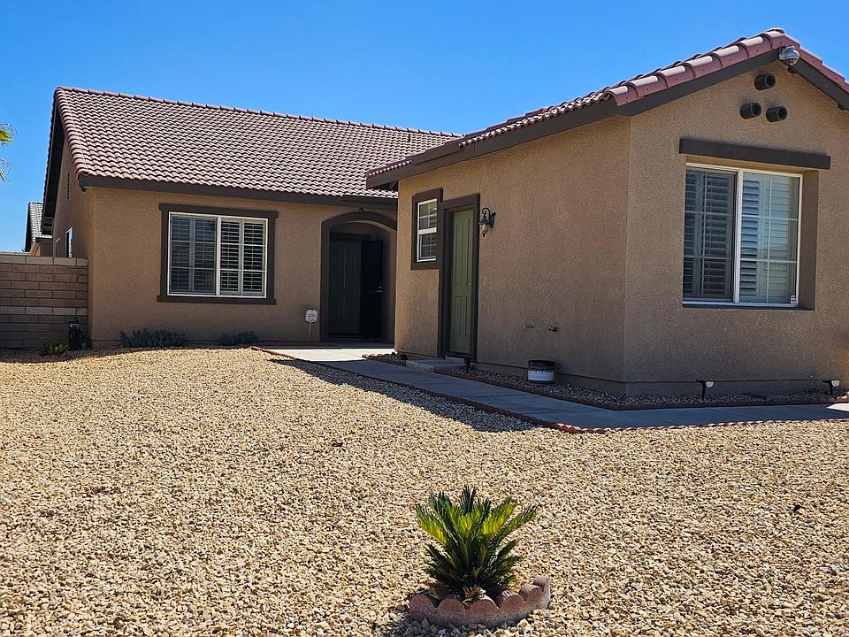 FRONT VIEW SHOWING BEAUTIFUL DESERT LANDSCAPING