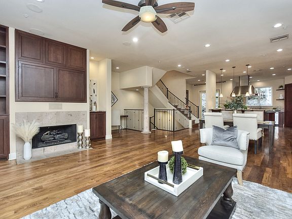 Open Floor Plan - main living space with balcony at front and covered patio in back.