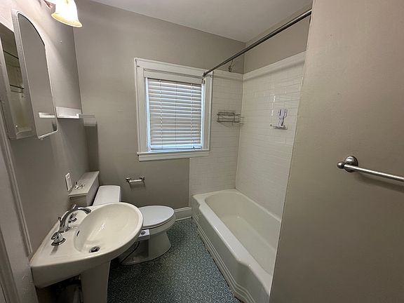 Bathroom w/tile surround and updated plumbing.