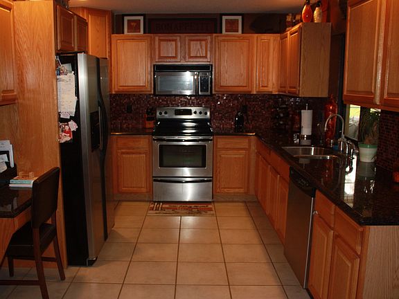 Kitchen with Glass Backsplash & Granite