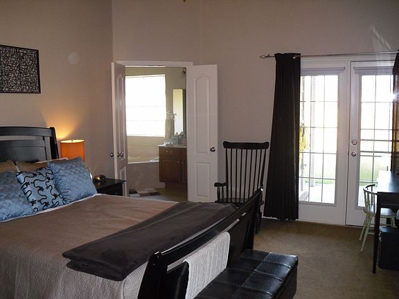 Master suite w/ 10ft ceilings and french doors to covered patio