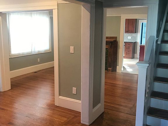From entry way with living room to the left and dining room beyond. Kitchen is at back of the house.