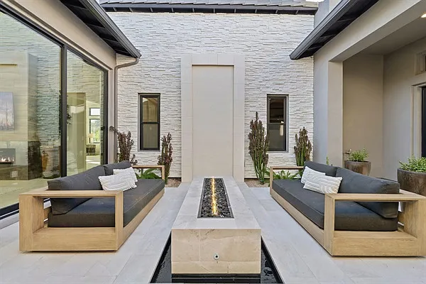 Ultimate desert luxury includes this stunning stone fire table to share enjoyable conversation and cozy nights.