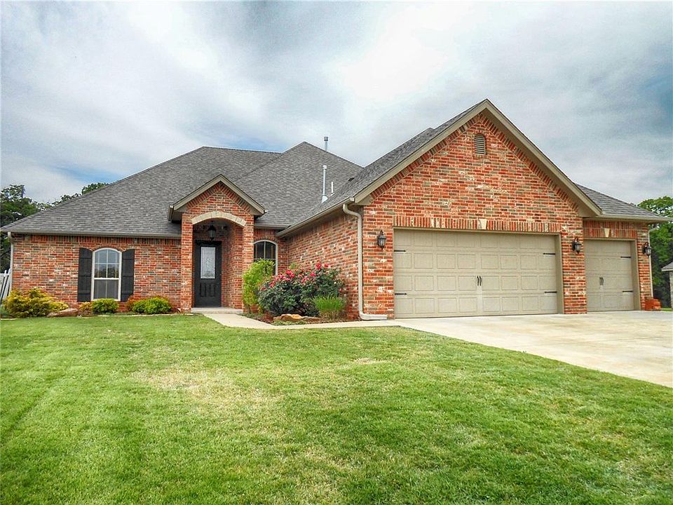 Attractive curb appeal with landscaping, 3 car garage and shutters.