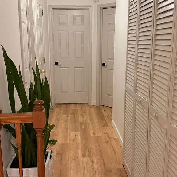 VIEW OF SECOND FLOOR CORRIDOR FROM STAIRS LANDING