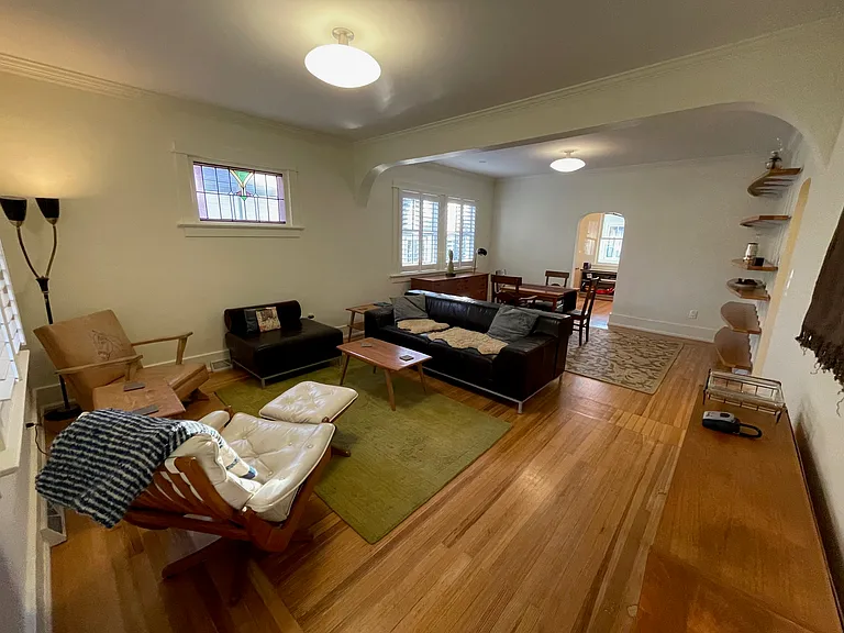 Hardwood floors and arched doorways.