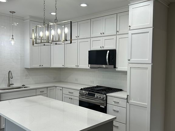Tons of cabinets and counters.