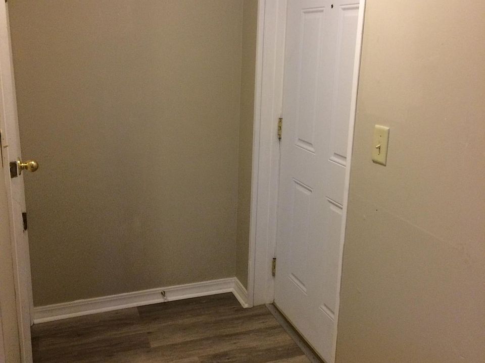 Entry door into foyer, leading into the kitchen.