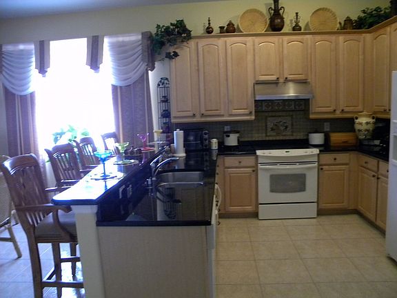 42" cabinets with trim, granite tops, commercial hood