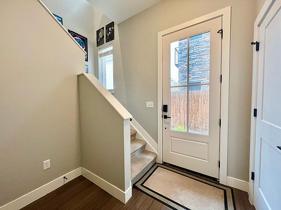 Entry way from attached 2 car garage on first floor which includes a half bath and storage closet.