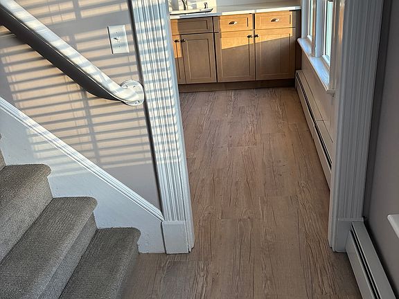 Foyer, entrance to kitchen and stairwell to 2nd floor