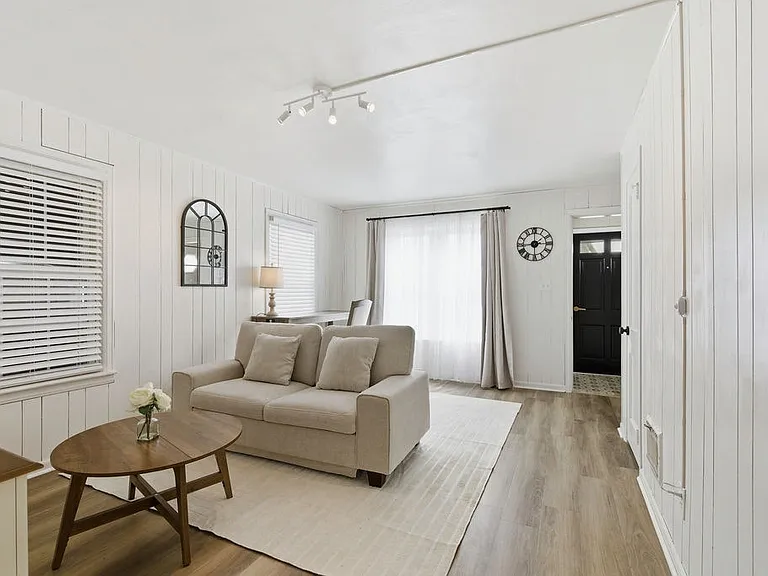 White decor paired with natural light enhances the home's bright, airy feel.