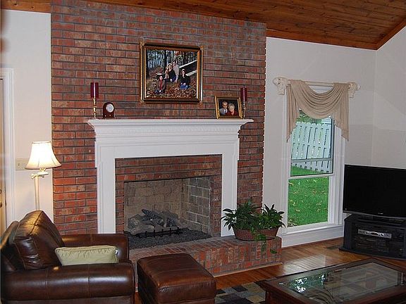 gas log fireplace in den
