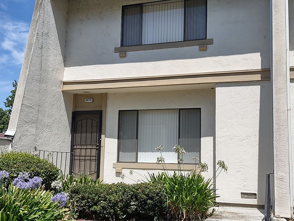 Entry to the property. Private end unit with neighbor on only one side. The upstairs window seen here is in the master bedroom.