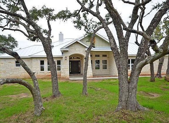 front view of home with mature trees