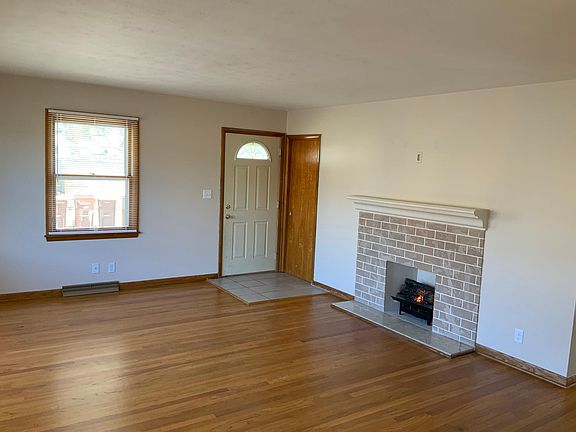 Living Room with faux fireplace, that works and provides additional heat