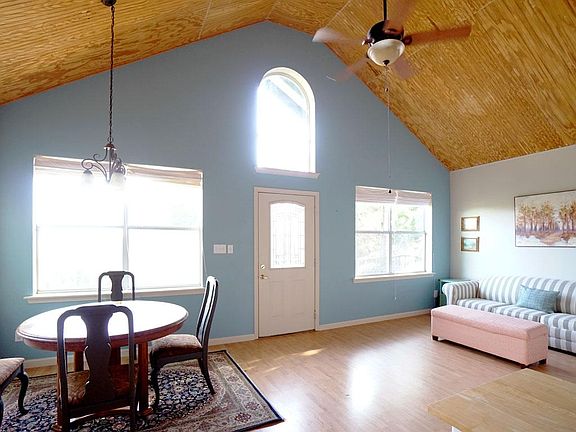 The open concept floor plan of the great room offers lots of natural light, hill country views, and is open to the kitchen.