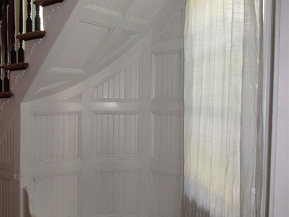 Charming nook with wood detailing.  The perfect spot to stop and remove your shoes.