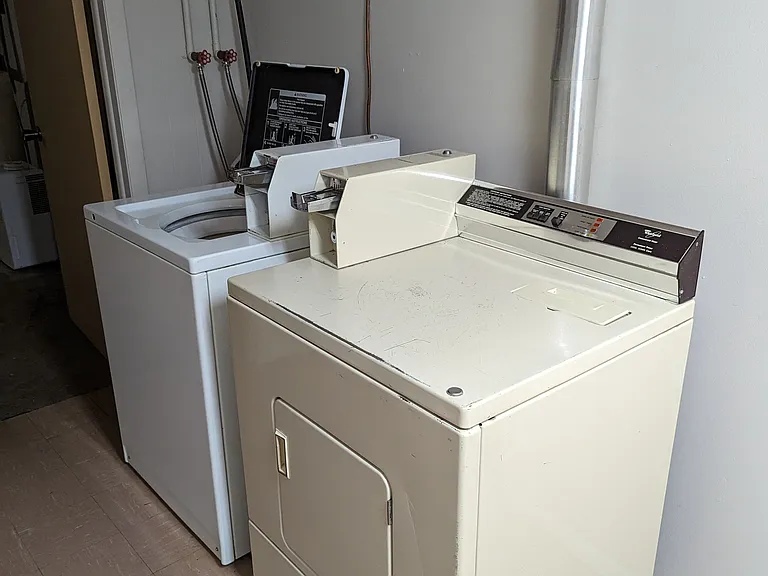 Coin operated W/D right outside door to Unit 5.
