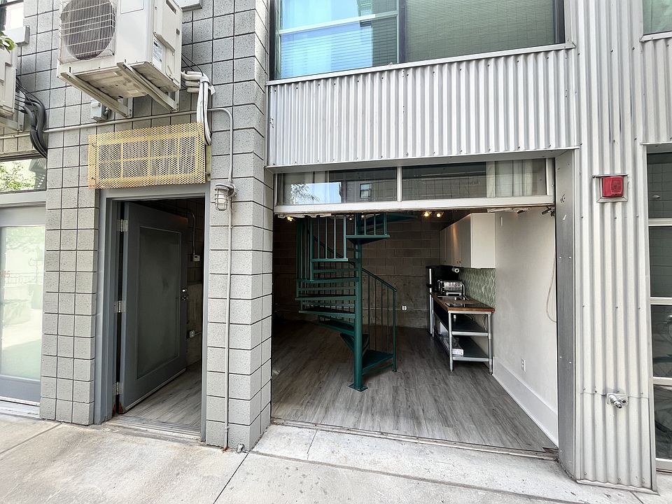 Front facade with garage door up